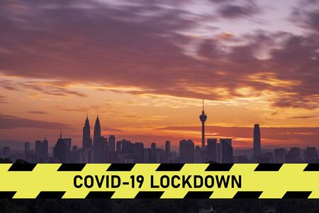 city scape with large covid-19 lockdown signの写真素材