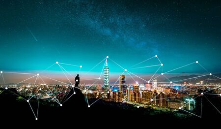 networking modern city with fiber crossing city human figure silhouetteの写真素材