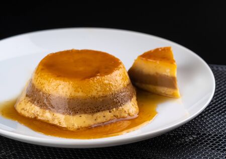 sweet caramel on white plateの写真素材