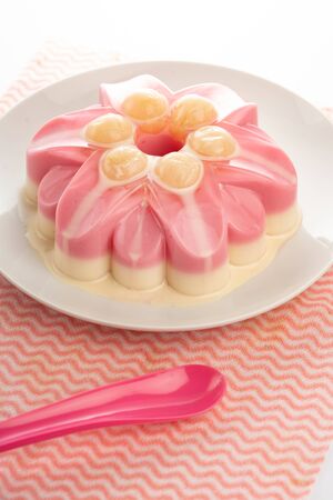 sweet pudding with longan sweetens milk on white backgroundの写真素材