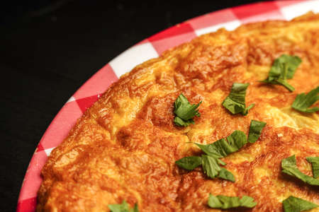 delicious omelet close up shot with leaf celery on top of itの写真素材