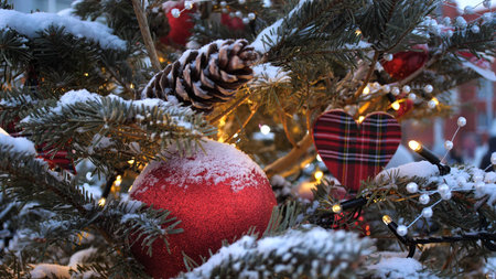 Street Christmas tree. Christmas balls, garlands and decorations on spruce treesの写真素材