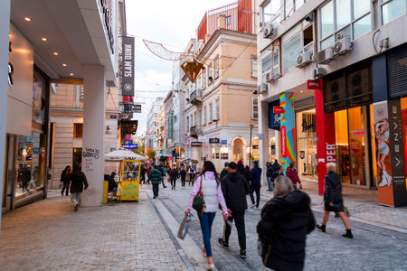 Athens, Greece - 24 Nov 2021: Ermou or Hermes Street is a shopping street in central Athens, connecting Kerameikos archaeological site with the Syntagma Square.