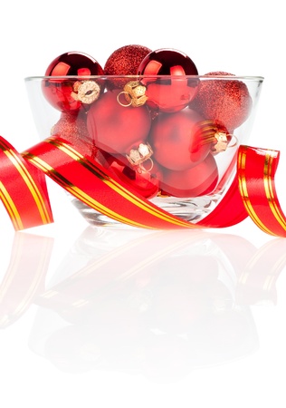 Set of red Christmas balls in the vase and ribbon Isolated on white backgroundの写真素材