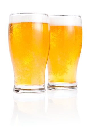 Two glasses fresh lager beer with foam Isolated on white backgroundの写真素材