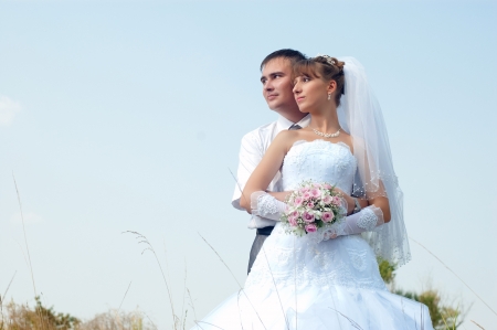 Happy bride and groom outdoorsの写真素材