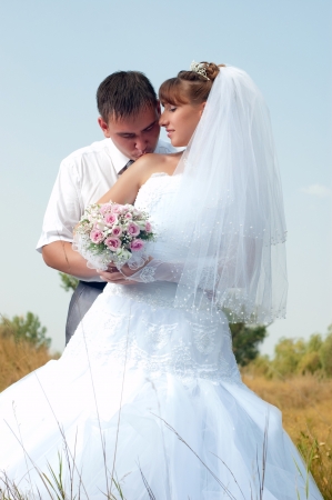 Happy bride and groom in wedding day outdoorsの写真素材