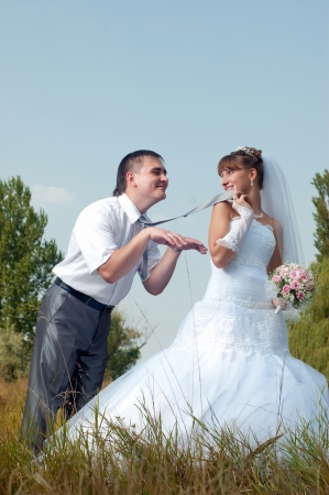 Happy bride and groom in wedding day outdoorsの写真素材