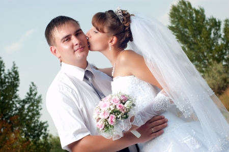 Happy bride and groom in wedding day outdoorsの写真素材