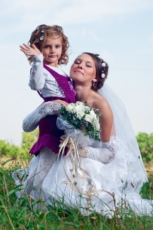Wonderful young fiancee and beautiful little girlの写真素材
