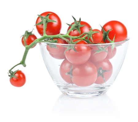 Branch of cherry tomato salad bowl in isolated white backgroundの写真素材