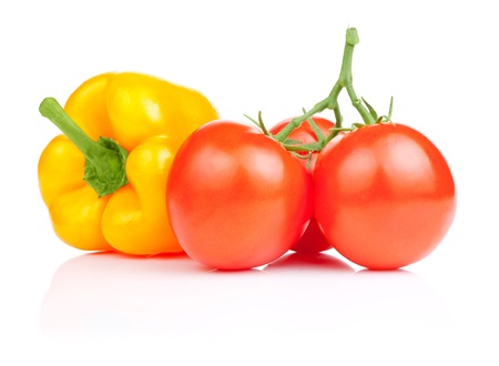 Sweet yellow bell pepper and Three Vine fresh juicy tomato Isolated on white backgroundの写真素材