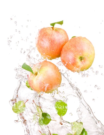 Three juicy red apple in water splash isolated on a white backgroundの写真素材