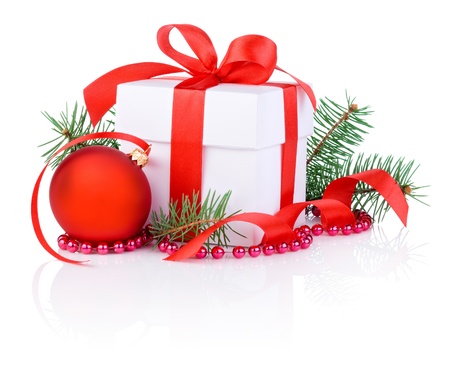 Christmas gift, red ribbon, tree branch and christmas ball Isolated on white backgroundの写真素材