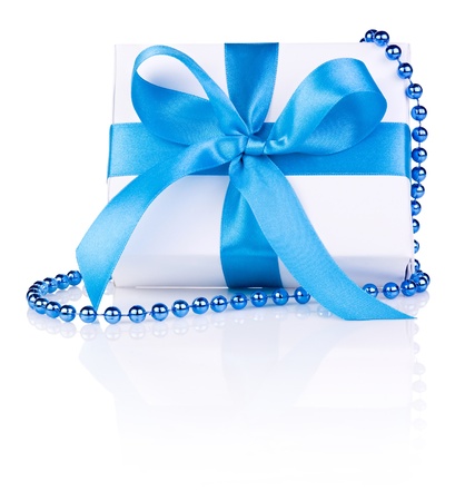 Christmas gift with ribbon bow and beads isolated on white backgroundの写真素材