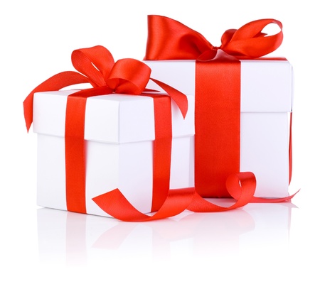Two White boxs tied with a red satin ribbon bow Isolated on white backgroundの写真素材