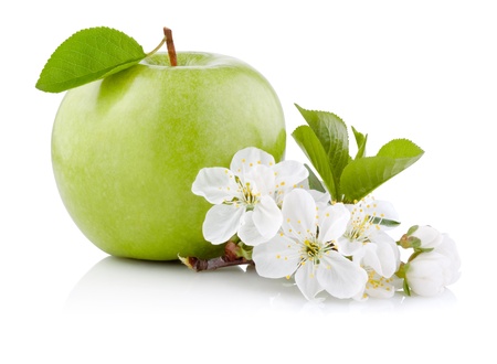 Single Green Apple with Leaf and Flowers isolated on a white backgroundの写真素材