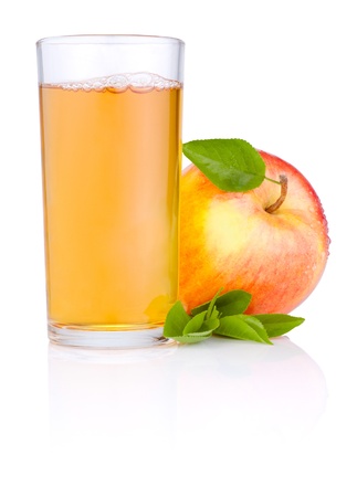 Apple juice in glass and Red juicy apple with green leaf on white backgroundの写真素材
