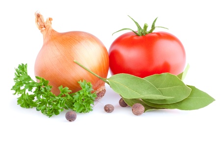 Fresh gold onions, red tomato, pimento, parsley and bay leaves isolated on white backgroundの写真素材