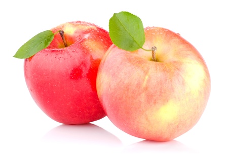 Two juicy Red apples with leaves and drops of water isolated on a white backgroundの写真素材