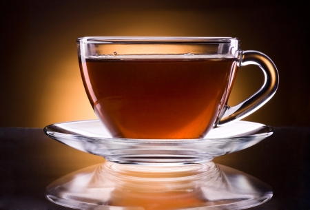 Cup of black tea isolated on a black backgroundの写真素材