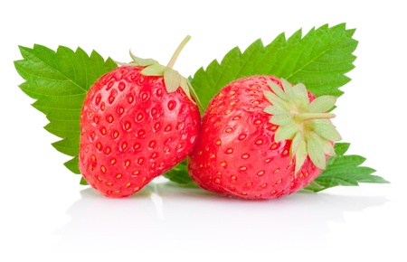 Two ripe red strawberries and a leaf isolated on white backgroundの写真素材