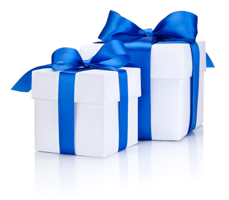 Two White boxs tied with a blue satin ribbon bow Isolated on white backgroundの写真素材