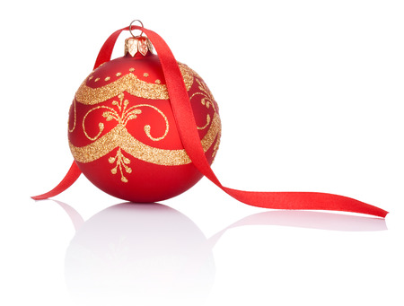 Red decorations Christmas ball with ribbon bow Isolated on white backgroundの写真素材