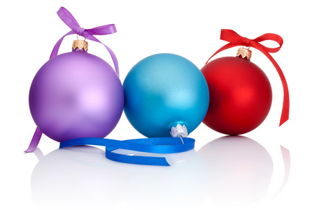 Purple, red and blue Christmas Ball with ribbon bow Isolated on white backgroundの写真素材