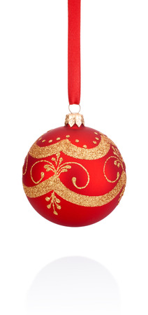 Red decorations Christmas ball hanging on ribbon Isolated on white backgroundの写真素材