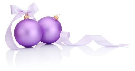 Two purple christmas balls with ribbon bow Isolated on white backgroundの写真素材