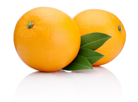 Two Ripe Oranges fruit with green leaves isolated on white backgroundの写真素材