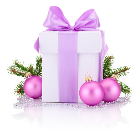 White boxs tied Pink ribbon bow, pine tree branch and christmas balls Isolated on white backgroundの写真素材