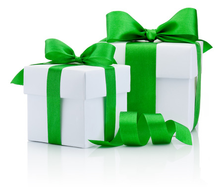 Two White boxs tied green ribbon bow Isolated on white backgroundの写真素材
