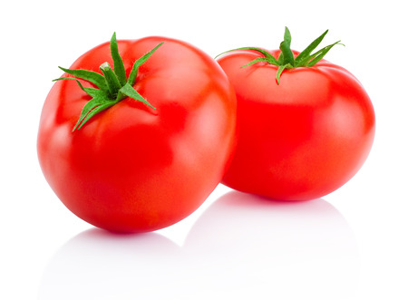 Two red tomatoes isolated on white backgroundの写真素材