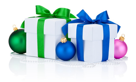 Two white gift boxes tied green and blue ribbon bow and christmas balls Isolated on white backgroundの写真素材