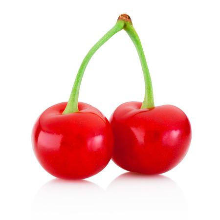 Two ripe red cherries isolated on a white backgroundの写真素材