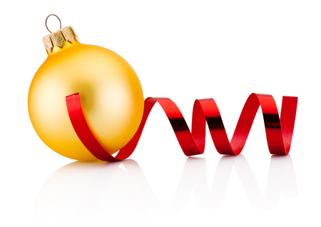 Christmas golden bauble and red curling paper Isolated on white backgroundの写真素材