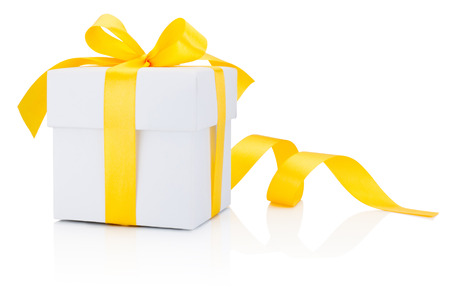 White gift box tied yellow ribbon bow Isolated on white backgroundの写真素材