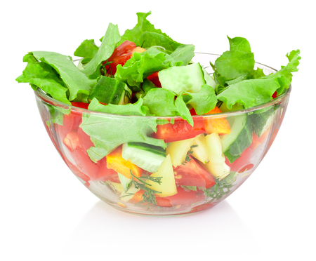 Fresh vegetable salad in glass bowl isolated on white backgroundの写真素材