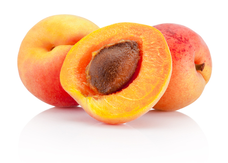 Fresh cut apricot fruits isolated on white backgroundの写真素材