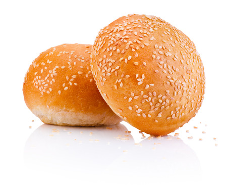 Two sandwich bun with sesame seeds isolated on white backgroundの写真素材