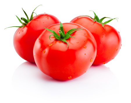 Three juicy red tomatoes isolated on white backgroundの写真素材