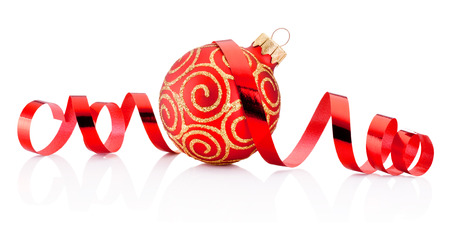 Red Christmas decoration bauble and curling paper isolated on white backgroundの写真素材