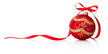 Red Christmas decoration bauble with ribbon bow isolated on white backgroundの写真素材