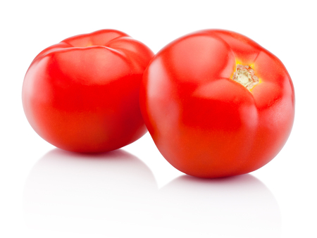 Two red tomatoes isolated on white backgroundの写真素材