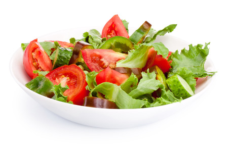 Fresh vegetable salad in a plate isolated on white backgroundの写真素材