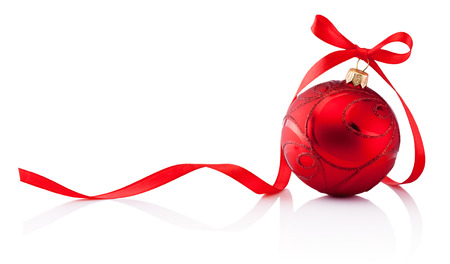 Red Christmas decoration bauble with ribbon bow isolated on white backgroundの写真素材
