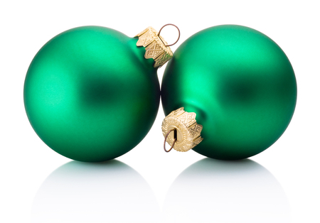 Two Christmas green baubles isolated on white backgroundの写真素材