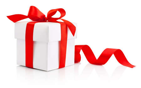 White gift box tied red ribbon bow Isolated on white backgroundの写真素材